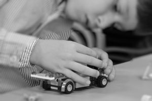 boy playing with car